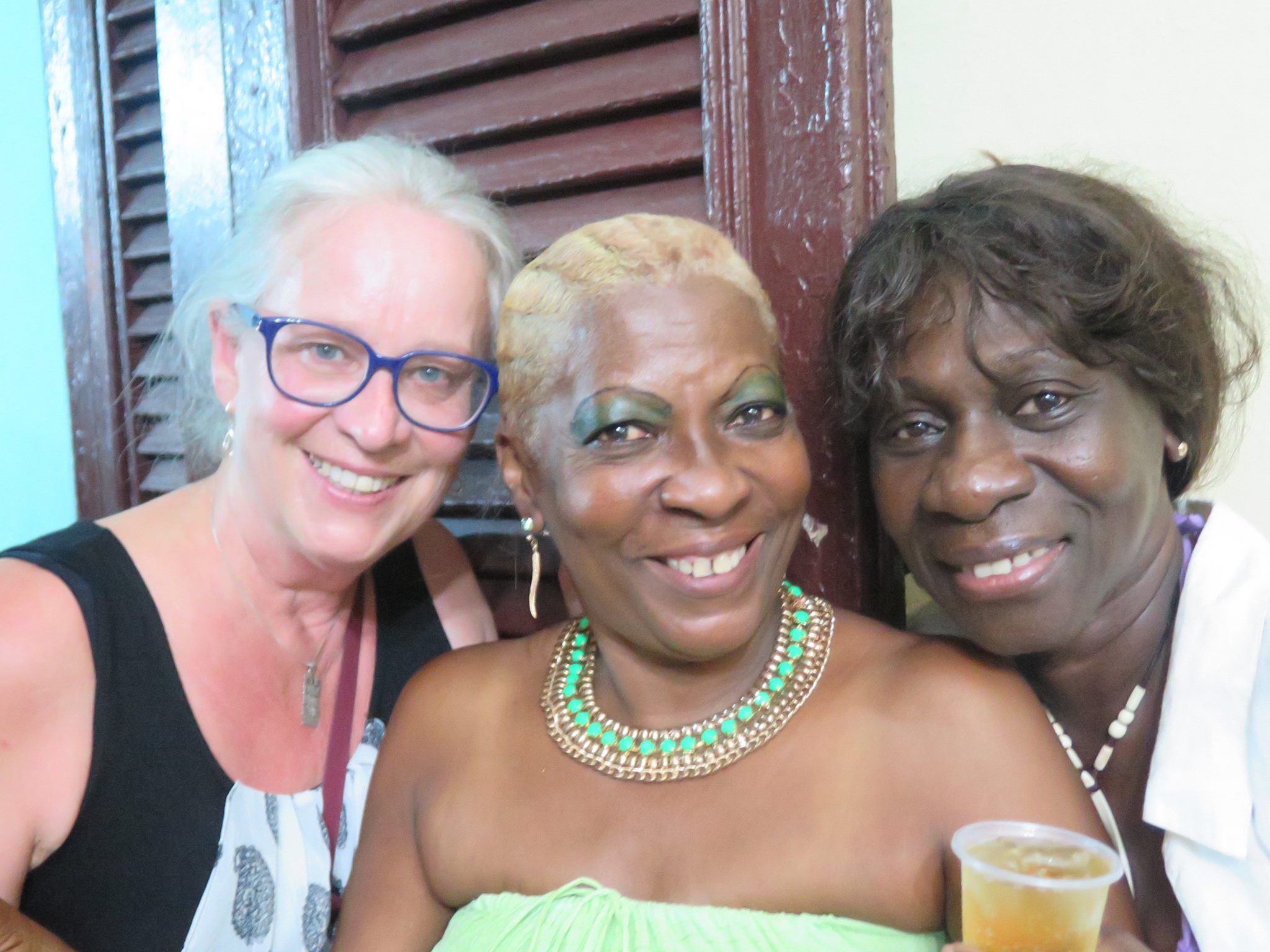 san lazaro, saint lazaro, celebration, worship, religion, santeria, catholicism, catholic, cuba, cuban, cuban streets, cuban celebration, streets of cuba, saint, patron saint of suffering, caribbean island, worshippers, women, cubanas, cubana, friends, smiles, smiling, smiling cubana friends